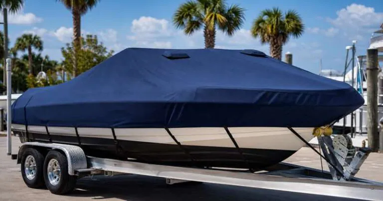 Trailering boat cover with raised vents on a covered boat at a marina